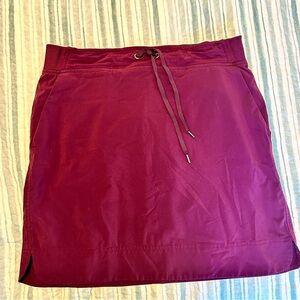 Athleta Skort size 8T maroon/purple with pockets.